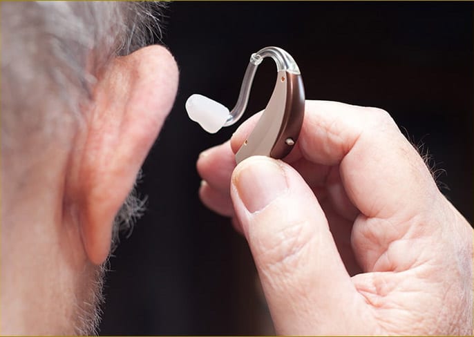 Image of man with hearing aid